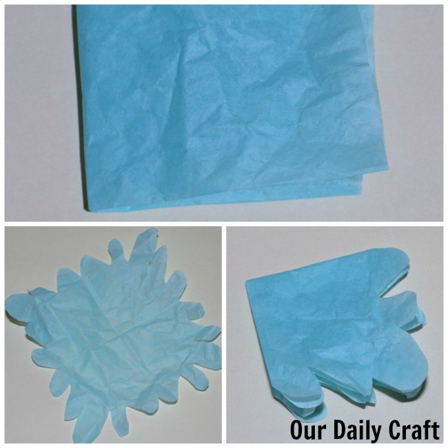 cutting tissue paper to make flowers