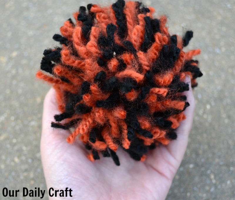 Yarn pompom orange and black