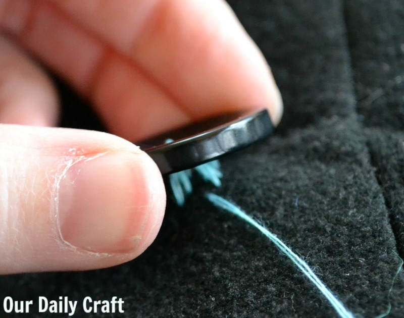 How to sew a button on a coat so it will stay on.