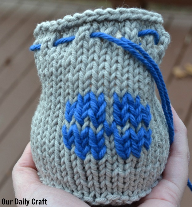 knit apple cozy with floral embellishment