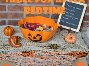 Make a cute trick-or-treat table for the porch so kids can get candy without ringing the doorbell.