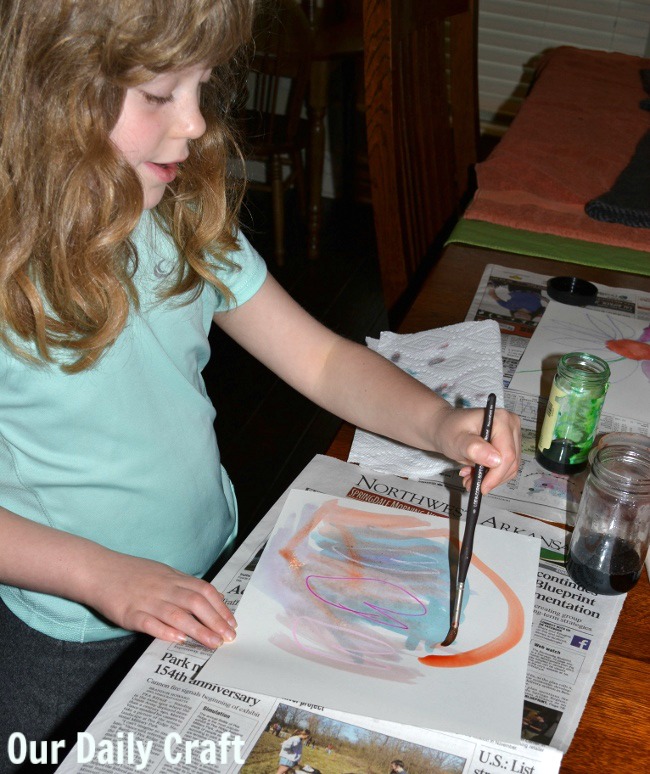 painting with watercolors on crayon