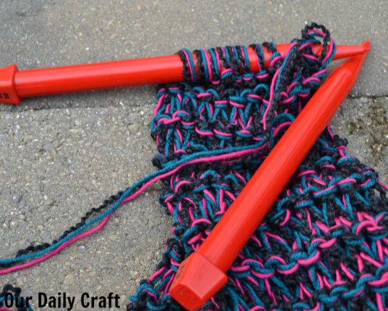 The knit scarf is perfect for knitters of all skill levels and is a quick and easy way to #givewarmth.